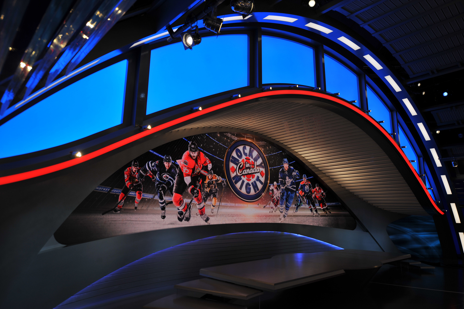 Hockey night in Canada Televsion set with a flowing arch backlit with LEDS and a massive video screen